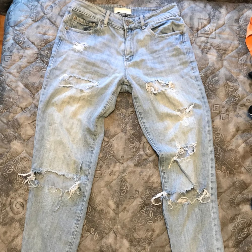 Ripped and distressed Garage mom jeans